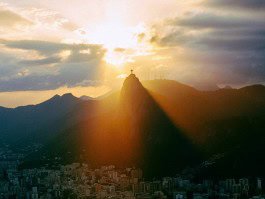 Sunset behind Christ the Redeemer statue in Rio de Janeiro, Brazil. 