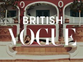Fashion magazine cover: a woman reclining on steps in front of a red villa, overlaid with the words BRITISH VOGUE 